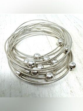 Sterling silver, interlocking wired bangle bracelet with sliding sterling balls